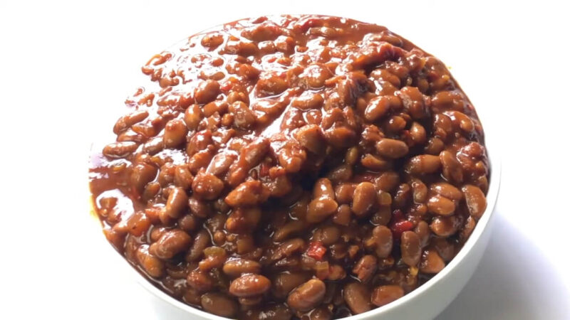 A bowl of food with baked beans